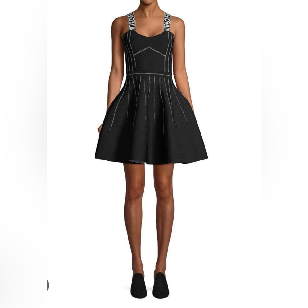 It’s sporty, flirty, and statement-making! This Maje dress is a stunner. Size 1